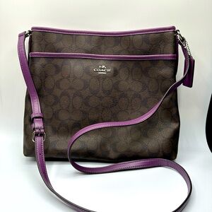 Coach logo cross body bag with purple leather trim.